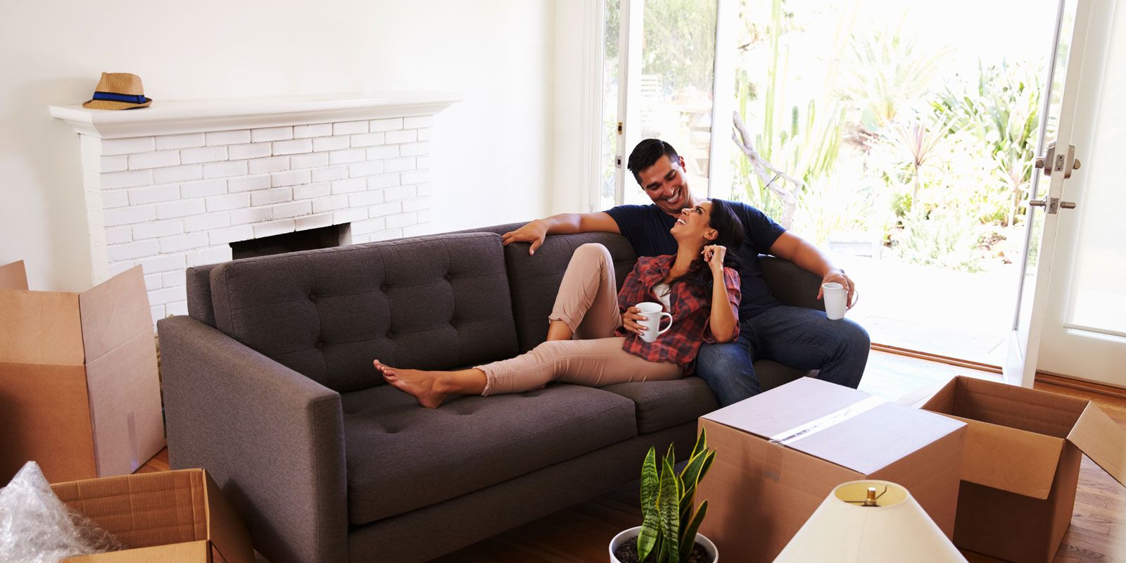 Couple who newly moved in chilling in the living room