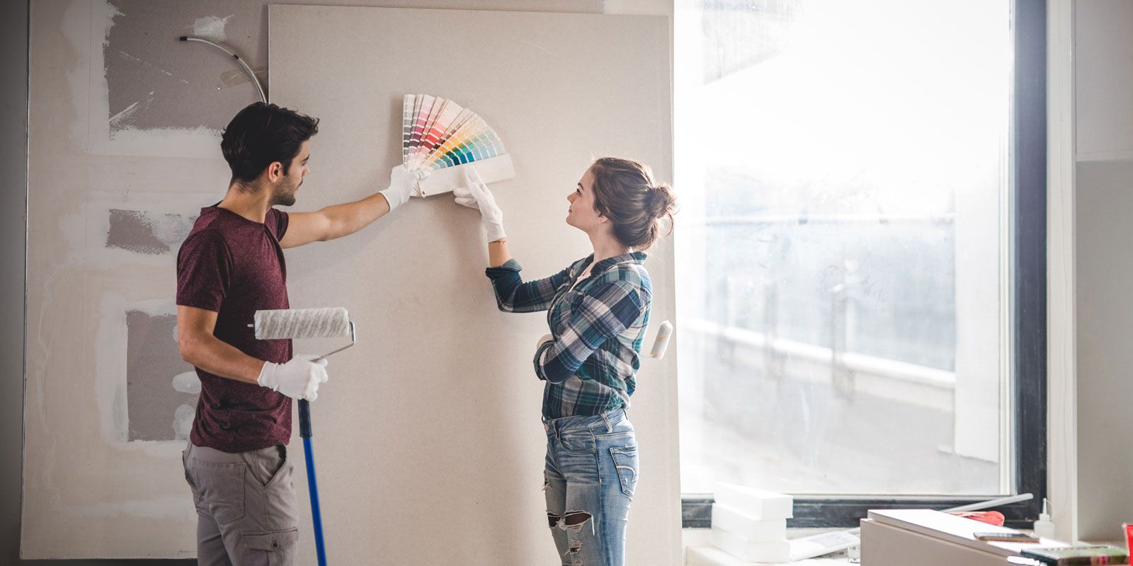 Couple choosing the color they would paint their wall